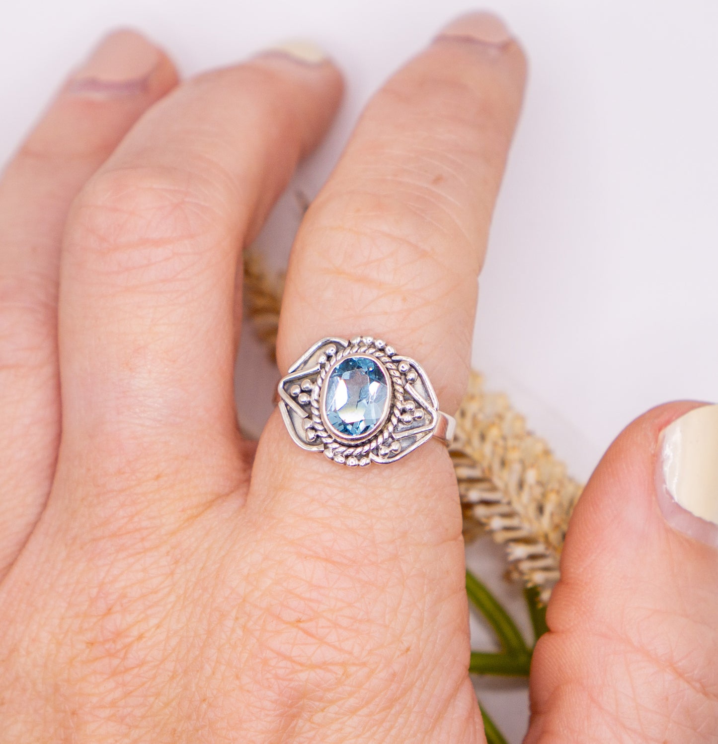 Oval Blue Topaz with Scroll Detail