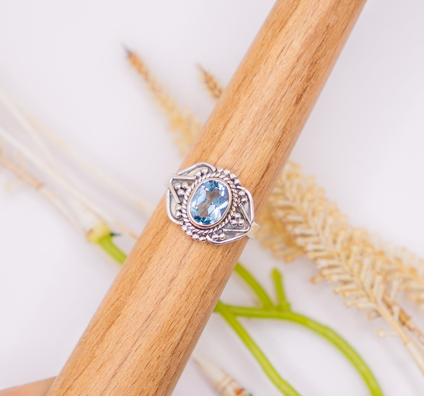 Oval Blue Topaz with Scroll Detail