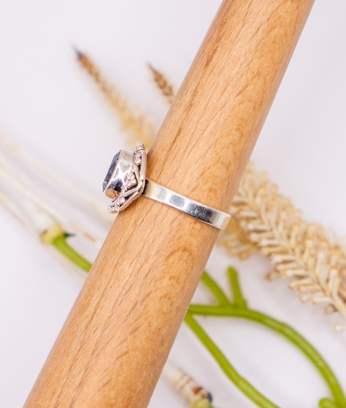 Oval Blue Topaz with Scroll Detail